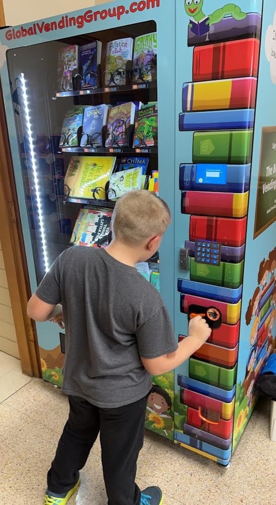 student using vending machine